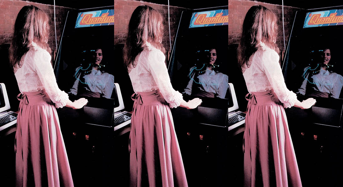 Betty Tylko in front of her arcade game, Quantum.